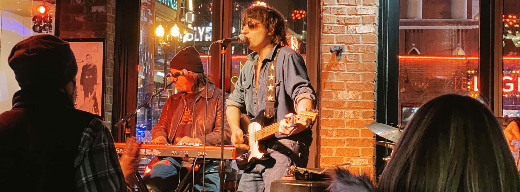 bar singer on guitar in Springfield