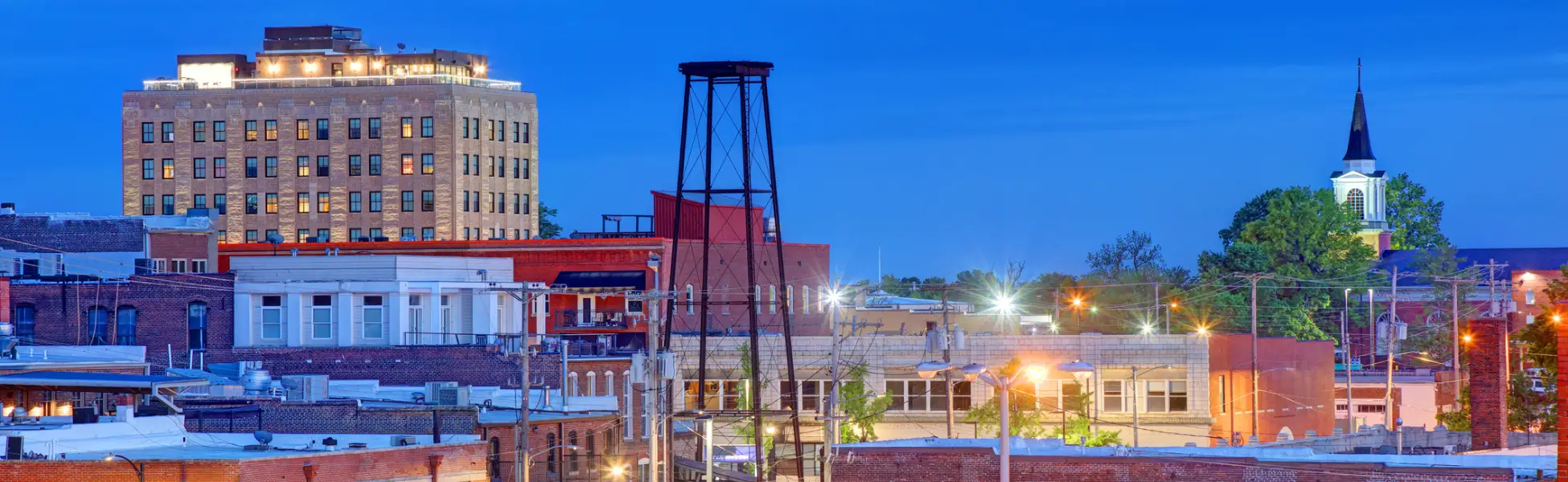 Neon color image of a band playing and people singing along
