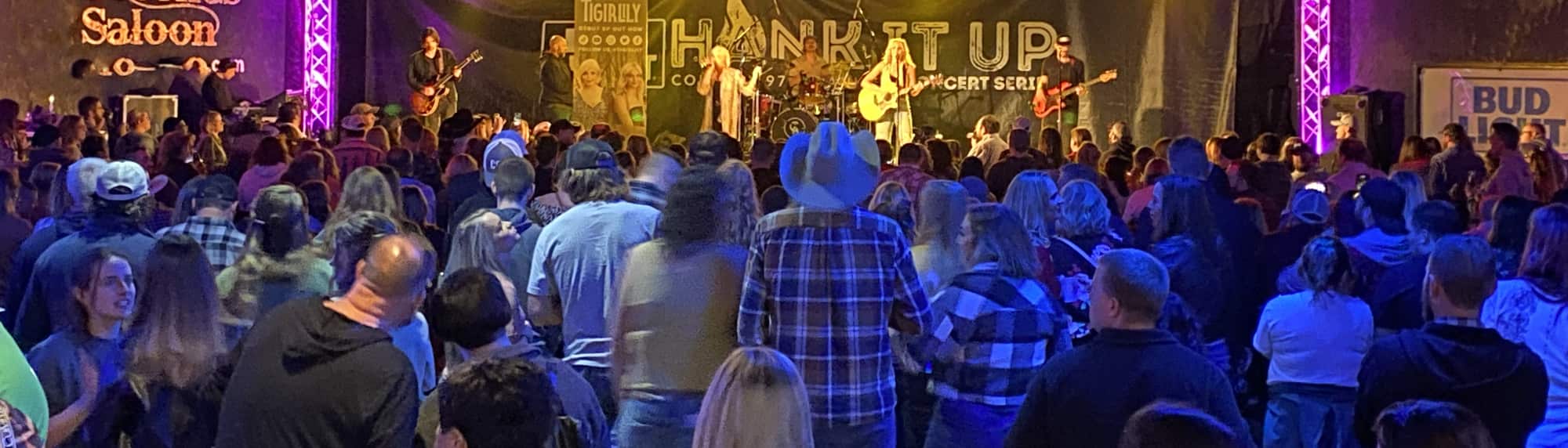 country concert with fans wearing cowboy hats Springfield